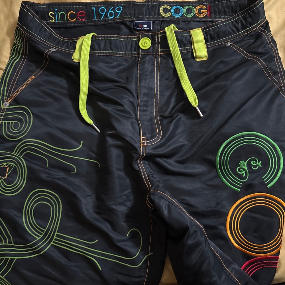 COOGI Black and Green Board Shorts with Bold Patterns